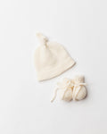 newborn undyed white knitted hat and booties