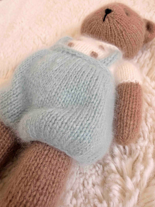 close up of cashmere newborn cuddly toy dressed in peter pan outfit